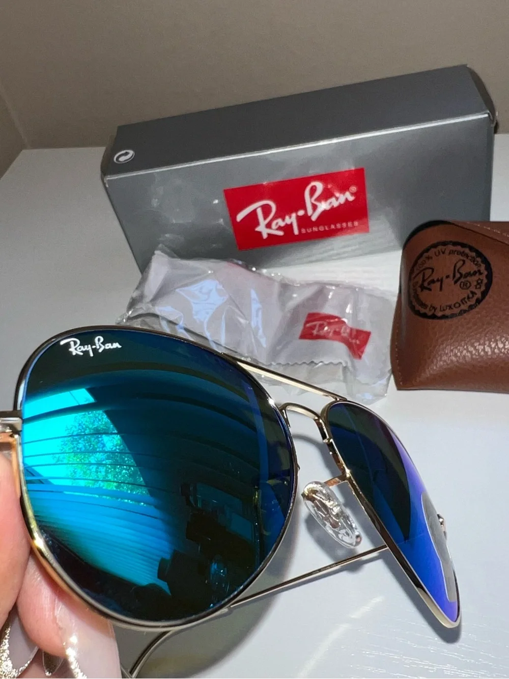 Ray-Ban Gold Frame Sunglasses with Blue Mirrored Lenses